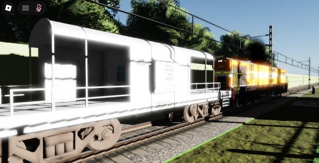 ALCO locomotive hauling a white caboose