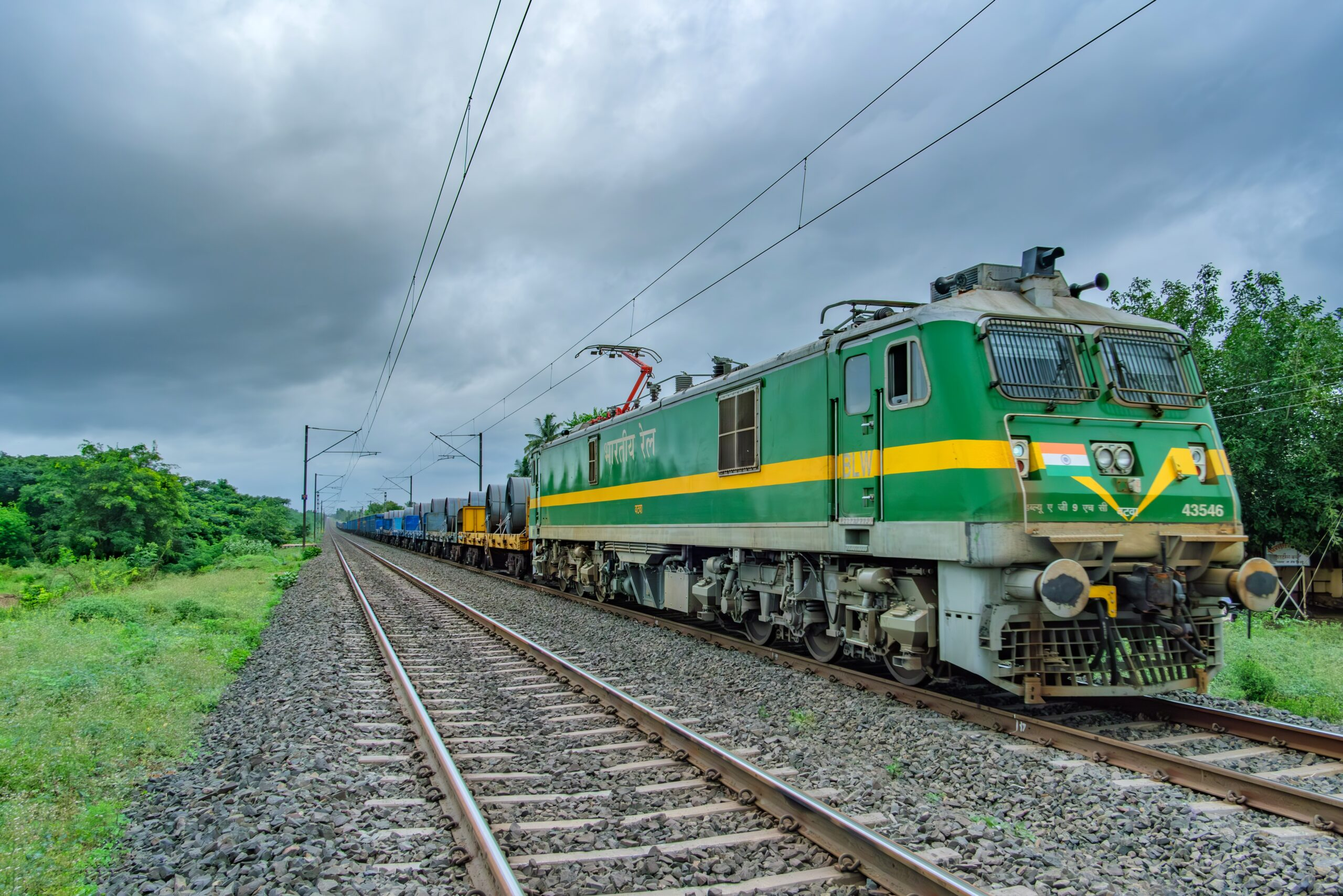 Green WAG-9 electric locomotive hauling a freight train